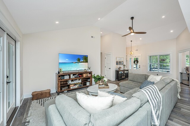 living room with high vaulted ceiling, wood-type flooring, and ceiling fan