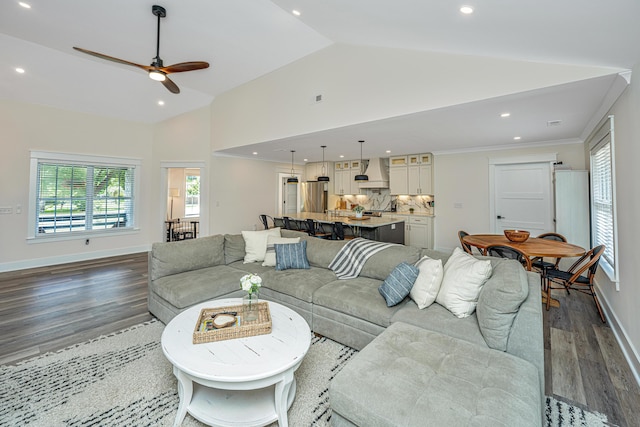 living room with high vaulted ceiling, hardwood / wood-style flooring, and ceiling fan