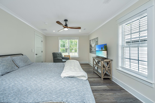 bedroom featuring ceiling fan, dark hardwood / wood-style floors, and crown molding