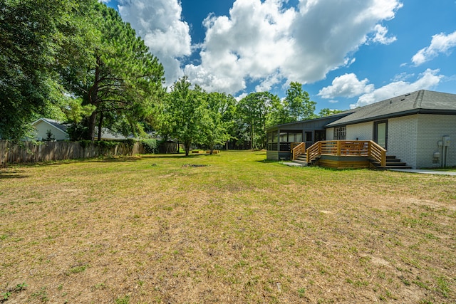 view of yard featuring a wooden deck