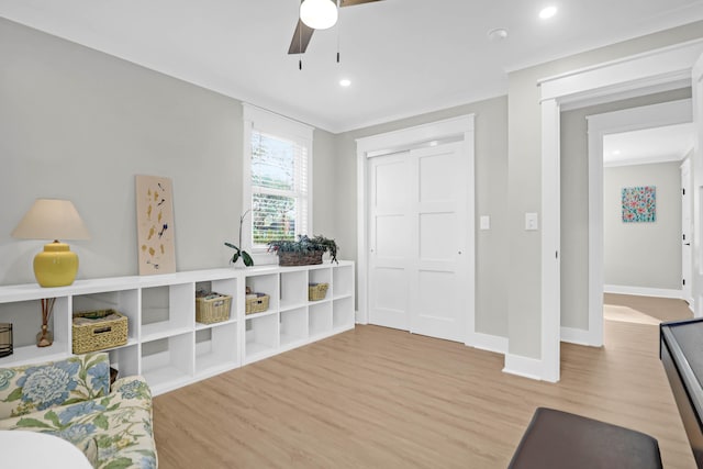 game room with ceiling fan and wood-type flooring