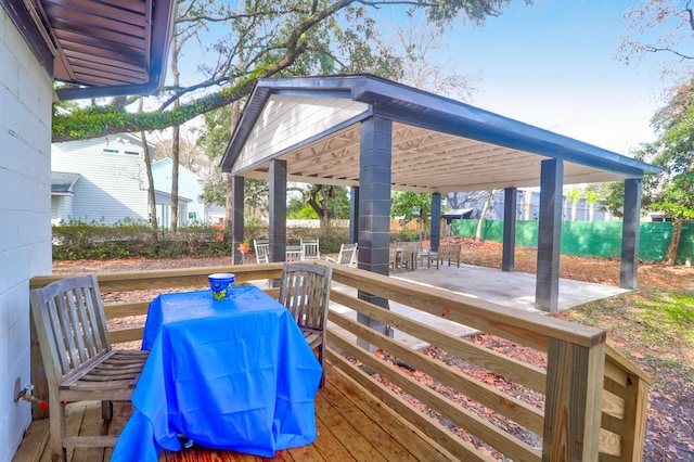 wooden terrace with a patio and grilling area