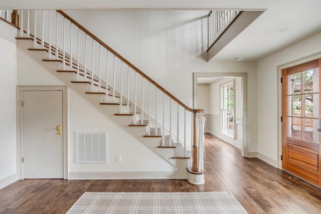 entrance foyer featuring dark wood-type flooring