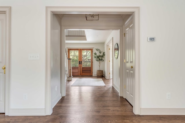 corridor featuring french doors and dark wood-type flooring