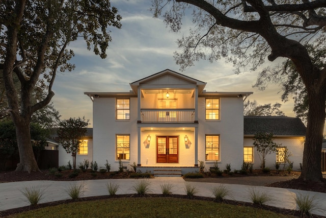 view of front of house featuring a balcony