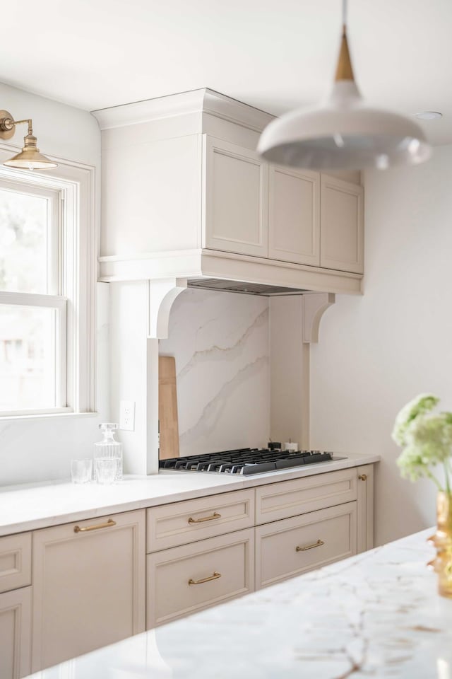 kitchen with backsplash and white gas stovetop