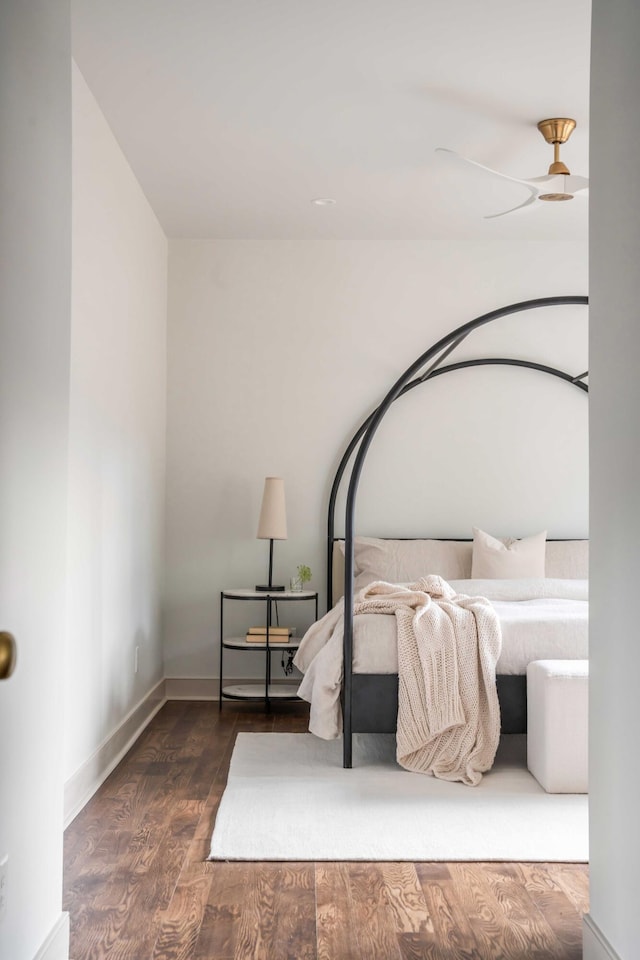 bedroom featuring dark hardwood / wood-style floors and ceiling fan