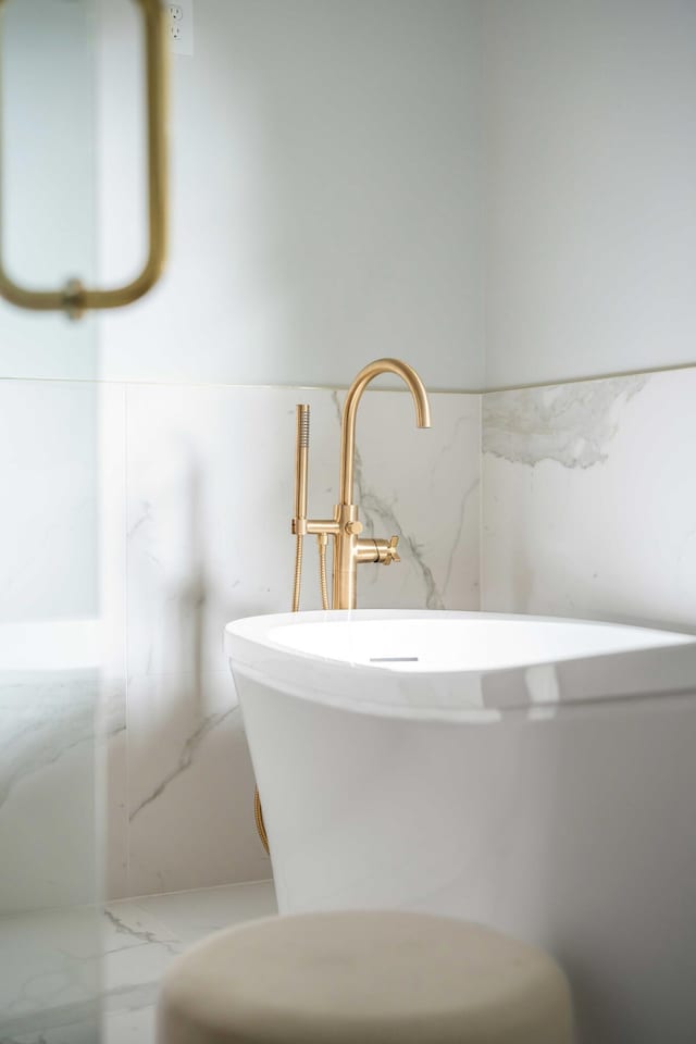 bathroom featuring a tub and sink