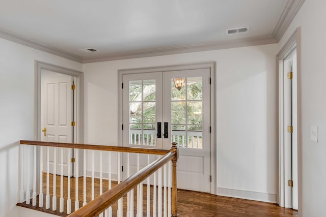 hallway with french doors, dark wood-type flooring, and ornamental molding