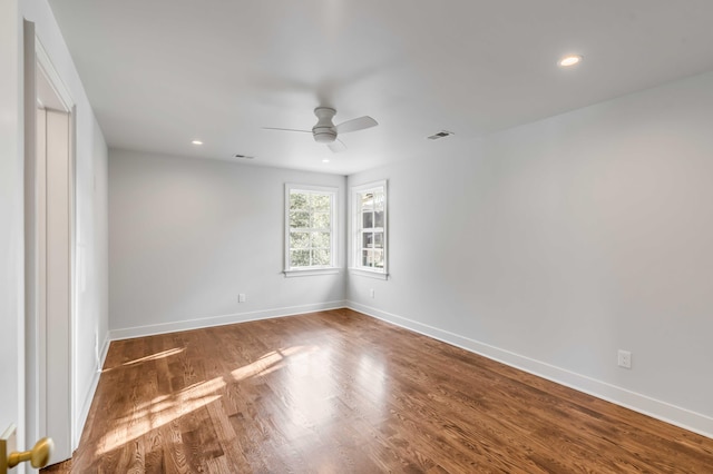 unfurnished room featuring ceiling fan and hardwood / wood-style floors