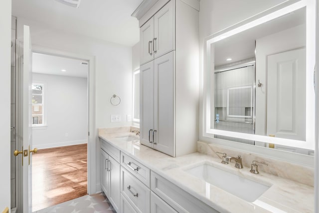 bathroom with vanity and an enclosed shower