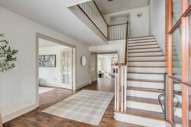 foyer with dark hardwood / wood-style flooring