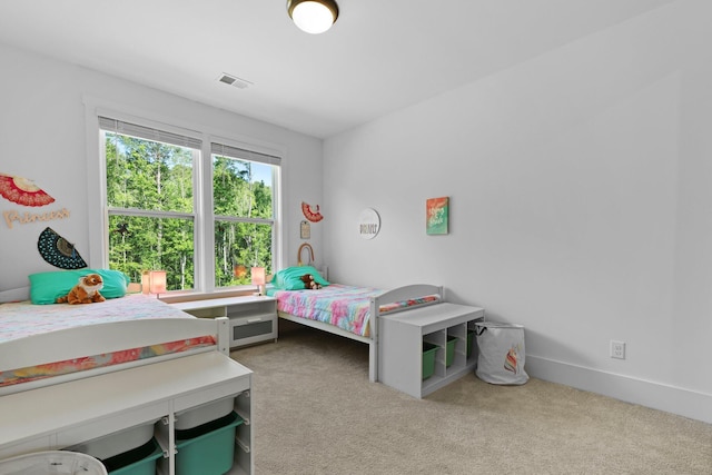 bedroom with carpet flooring and baseboards