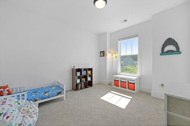 bedroom with carpet flooring and baseboards