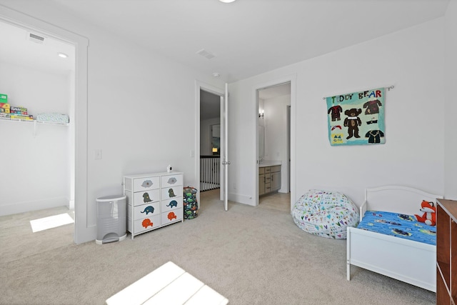 bedroom with carpet floors and baseboards