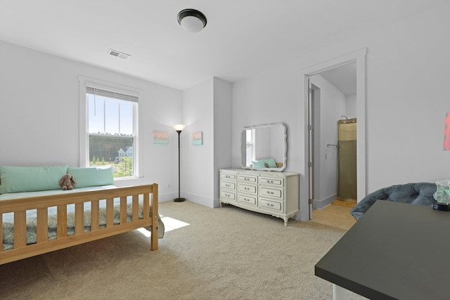 bedroom with light carpet