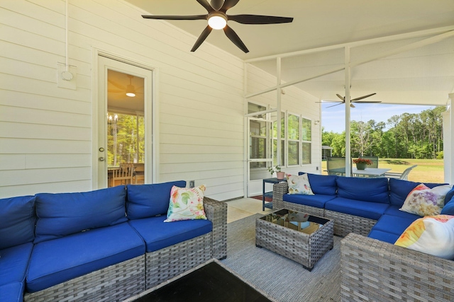 sunroom / solarium featuring an outdoor living space and ceiling fan