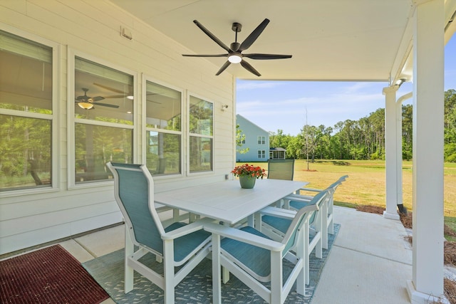 view of patio featuring outdoor dining area and ceiling fan