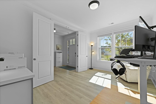 office featuring light wood-type flooring and baseboards