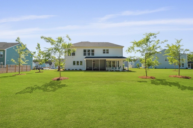 rear view of house with a sunroom