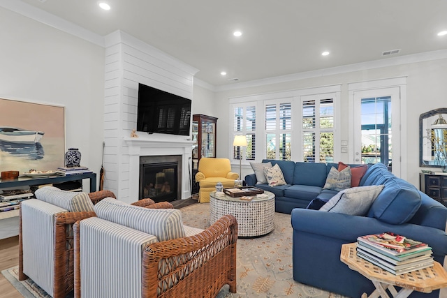 living room featuring crown molding and light wood-type flooring