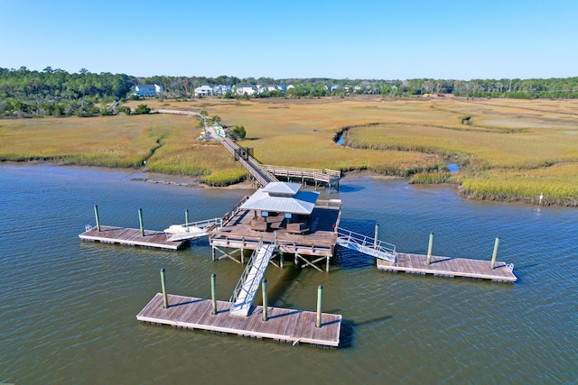 dock area featuring a water view and a rural view