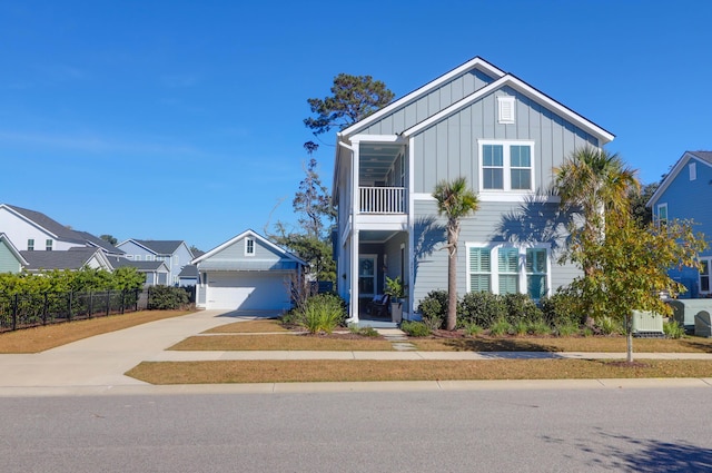 view of front of property with a balcony and a garage