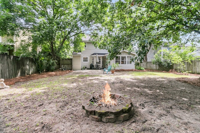 1433 Oaklanding Rd, Mount Pleasant, SC 29464 - rear view of property featuring an outdoor fire pit, a fenced backyard, and a patio