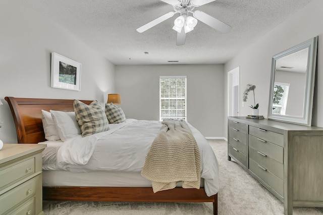 1433 Oaklanding Rd, Mount Pleasant, SC 29464 - bedroom featuring light colored carpet, a textured ceiling, and a ceiling fan