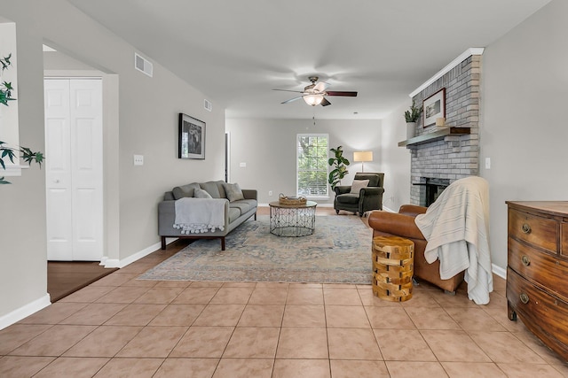 1433 Oaklanding Rd, Mount Pleasant, SC 29464 - living room with a ceiling fan, light tile patterned flooring, and a brick fireplace