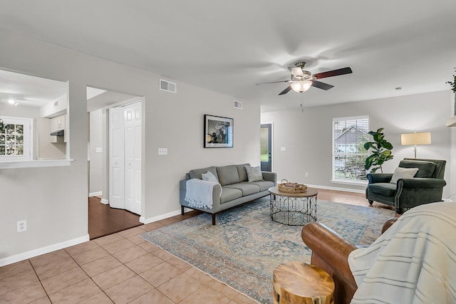 1433 Oaklanding Rd, Mount Pleasant, SC 29464 - living room featuring light tile patterned flooring and a ceiling fan