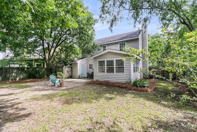 1433 Oaklanding Rd, Mount Pleasant, SC 29464 - rear view of house featuring a fenced backyard and a chimney