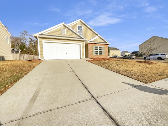 view of front of property featuring a garage and central air condition unit