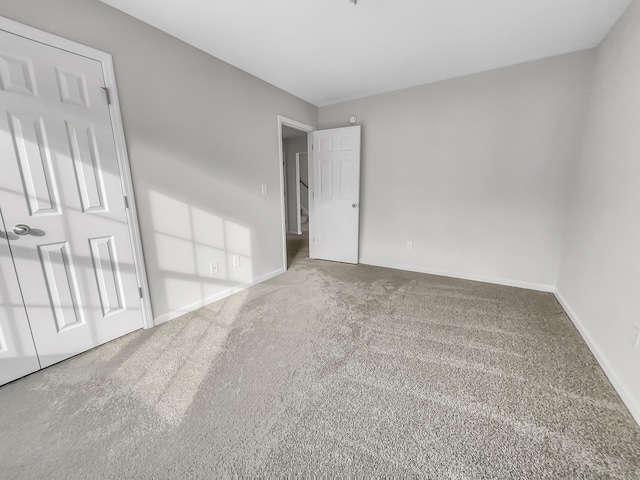 unfurnished bedroom featuring carpet