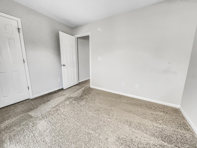 spare room with carpet floors