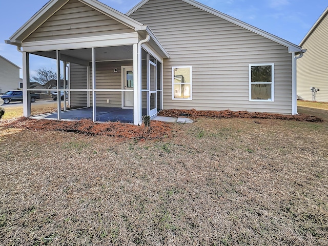 view of front of home featuring a patio area and a sunroom