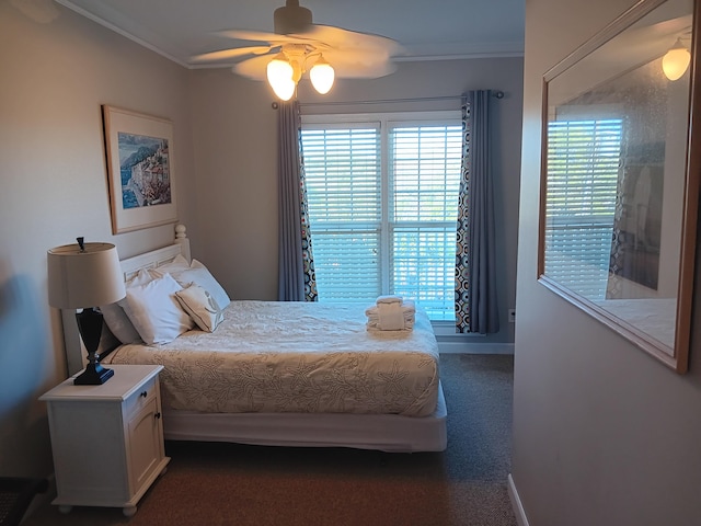 carpeted bedroom with ceiling fan and ornamental molding