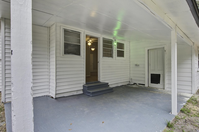 entrance to property featuring a patio