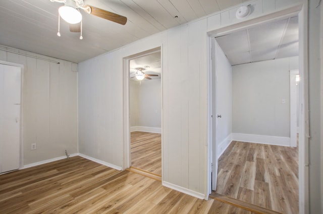 interior space with ceiling fan and wood-type flooring