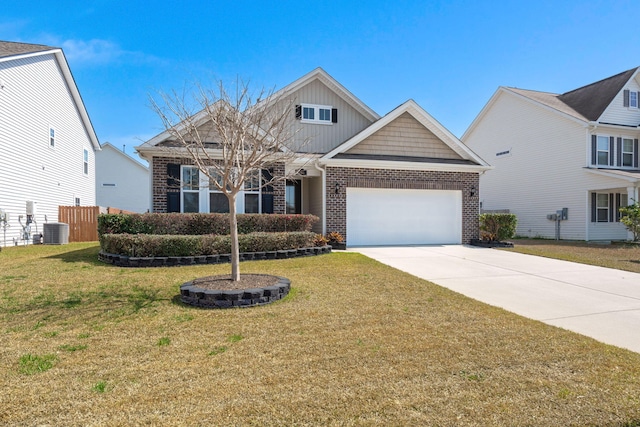 view of front of home with central air condition unit, driveway, a front yard, an attached garage, and brick siding