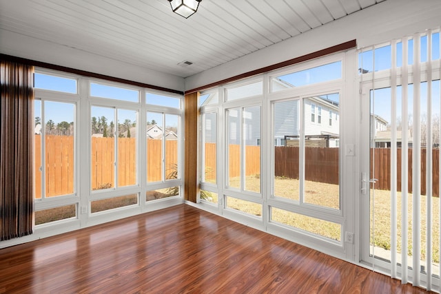 unfurnished sunroom featuring wooden ceiling