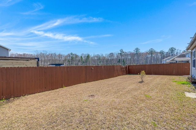 view of yard featuring a fenced backyard