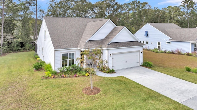 view of front of home with a garage, a front yard, concrete driveway, and a shingled roof