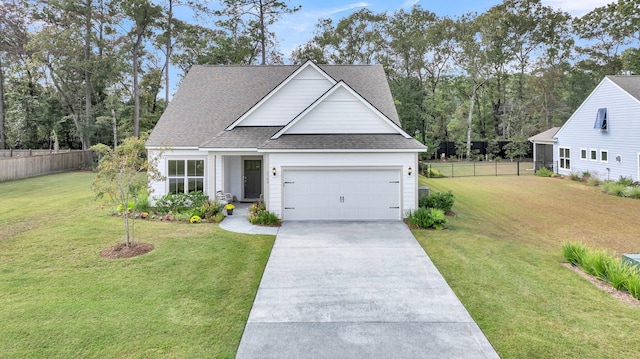 view of front of home featuring a shingled roof, fence, a front lawn, and concrete driveway