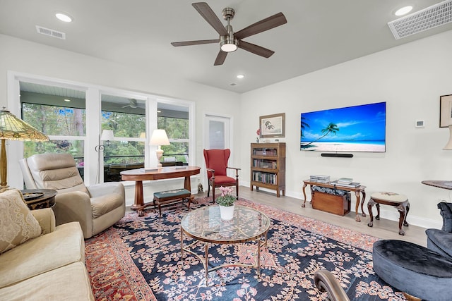 living room with recessed lighting, visible vents, and ceiling fan