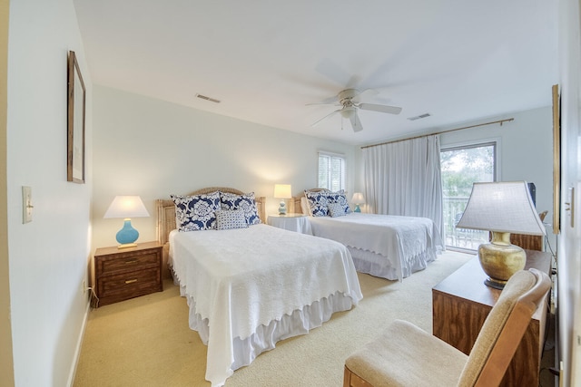 carpeted bedroom featuring access to outside and ceiling fan