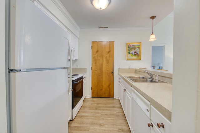 kitchen featuring white cabinetry, decorative light fixtures, white appliances, sink, and light hardwood / wood-style flooring