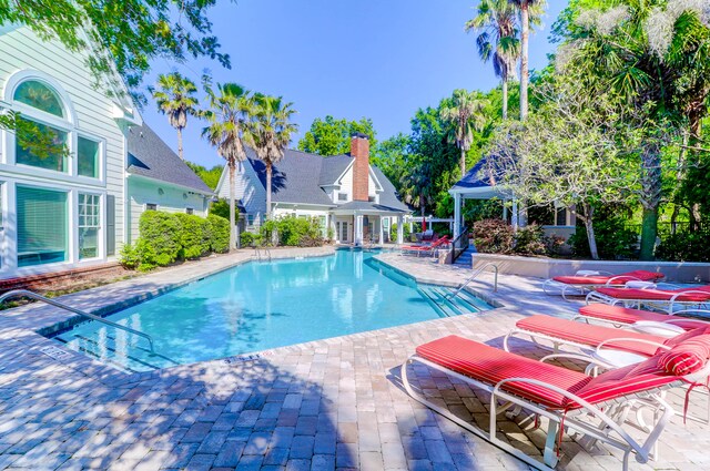 view of swimming pool with a patio area