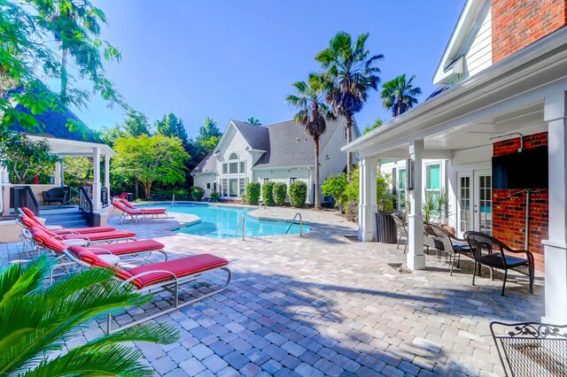 view of swimming pool featuring a patio