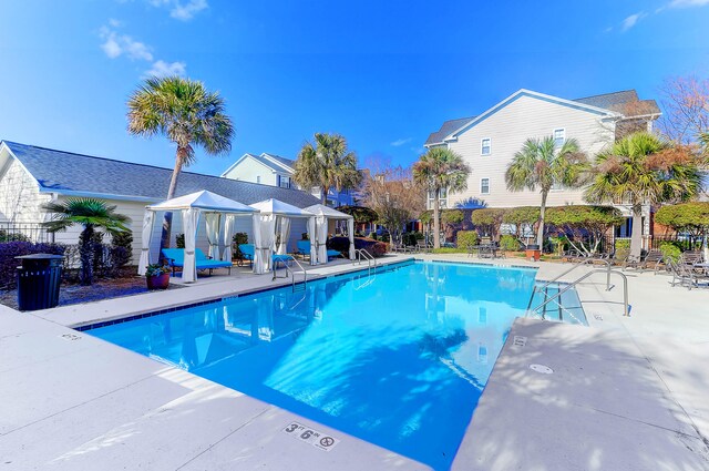 view of swimming pool with a gazebo and a patio